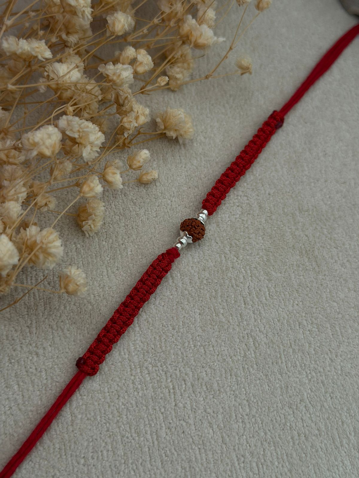 Single Rudraksha Silver Rakhi (Red)